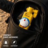 Ultra-compact 14cm Doraemon pocket selfie stick unfolded next to a smartphone